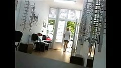 Horny optometrist flashing and playing in office